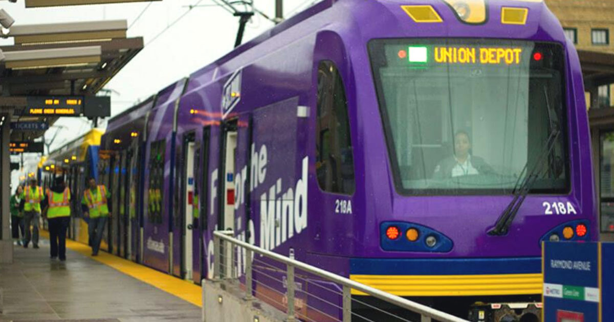 Green line train stopped at Union Depot platform in Saint Paul.