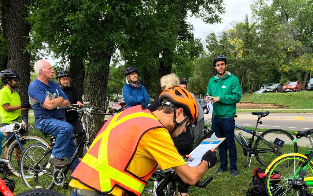 People gathered on the Bruce Vento trail, taking surveys about the Rush Line and hearing from a Ramsey County representative. Bruce Vento Rush Line