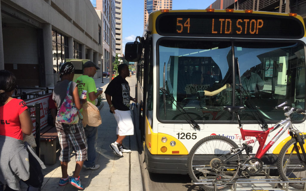 People boarding the metro transit 54 bus