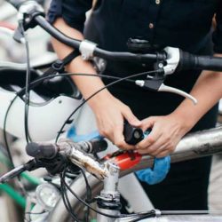 Woman parking and locking her bike