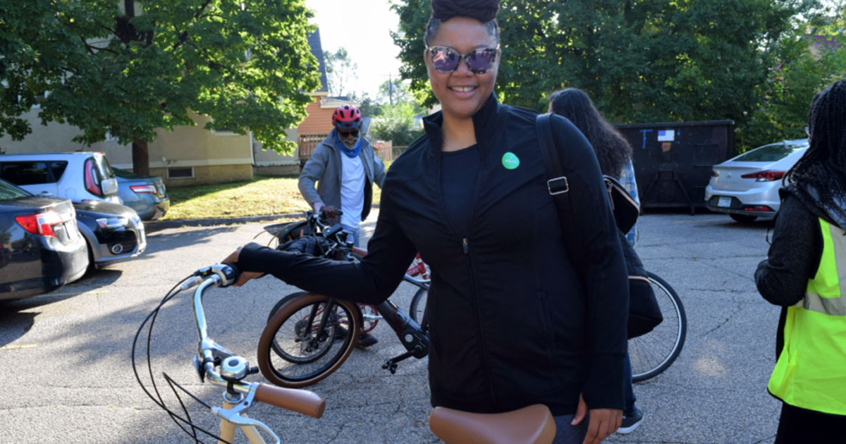 Young woman voting by bike