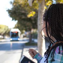 Young woman waiting for the bus