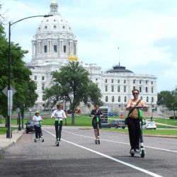 People scootering in Saint Paul