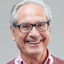 Smiling mature man with glasses and receding hair