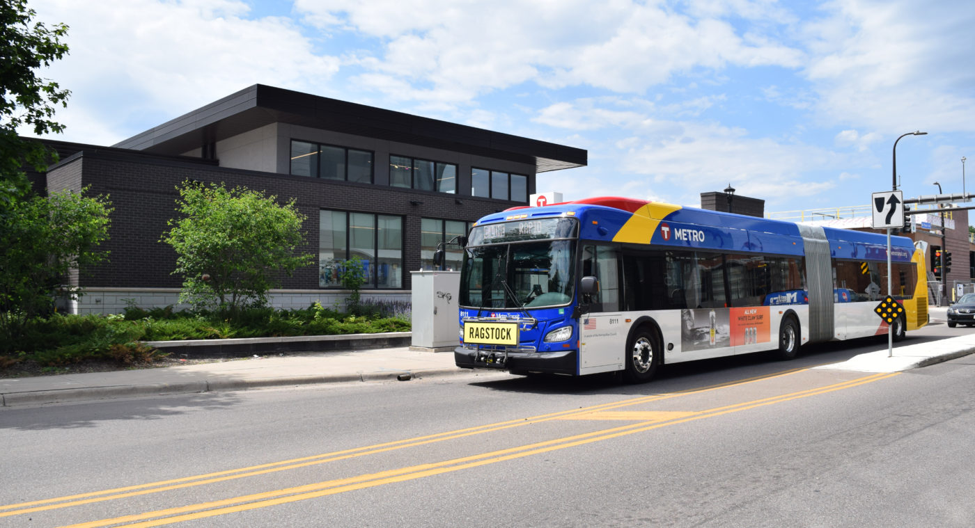 A Metro Transit rapid bus drives down the street.