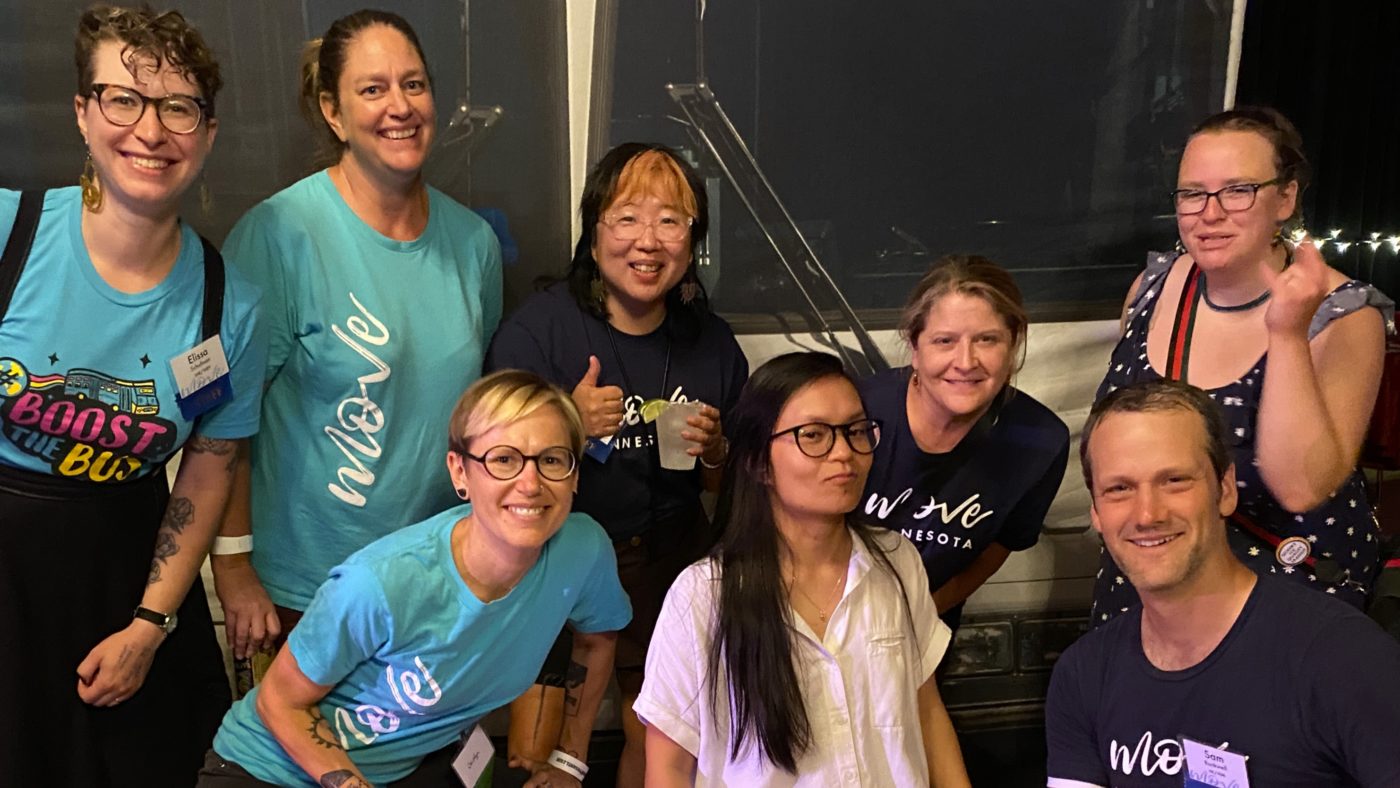 Members of the Move Minnesota team stand together at a local event.