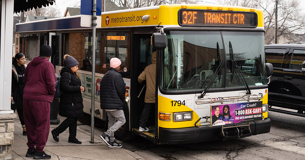 Five people board a Metro Transit Route 32 bus in the Twin Cities.