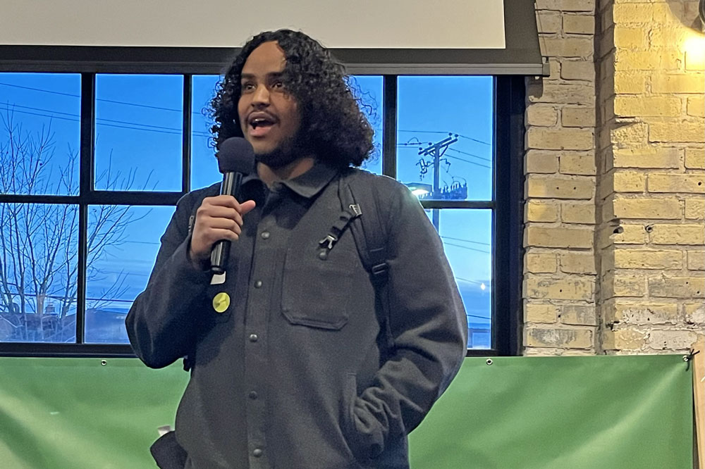 Transit rider, Amir Adan, a young Black man with a mustache and chin-length hair, spoke about the importance of transit in his life
