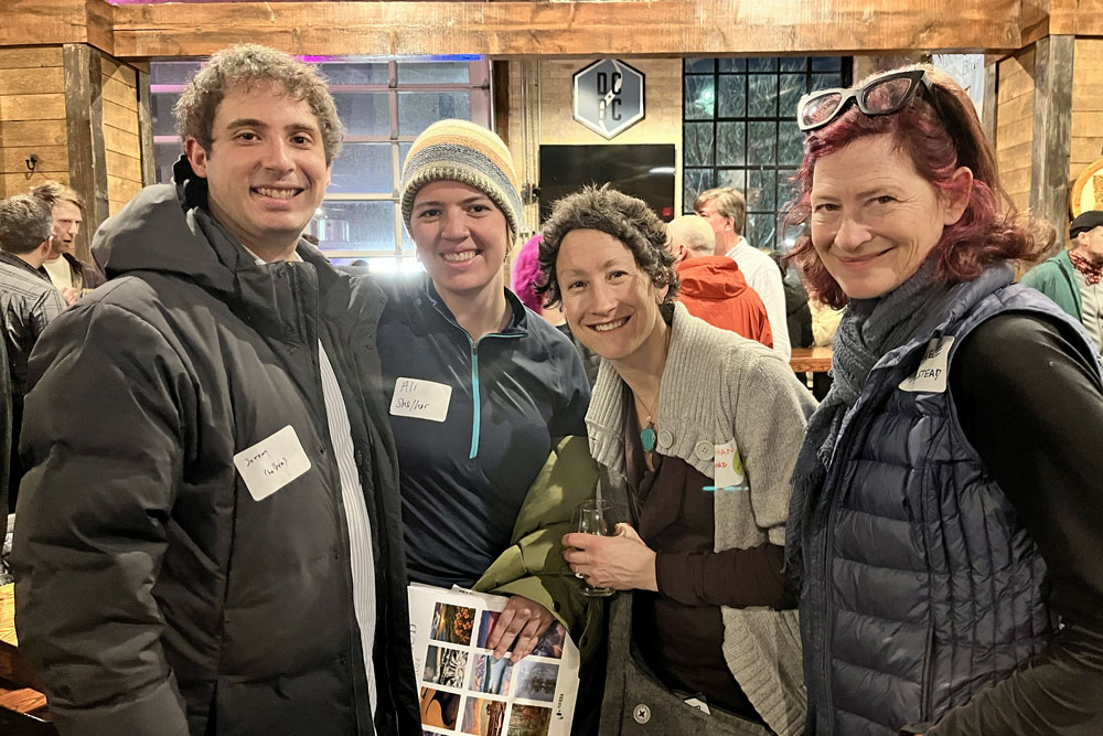 A group of four advocates smiling at the event