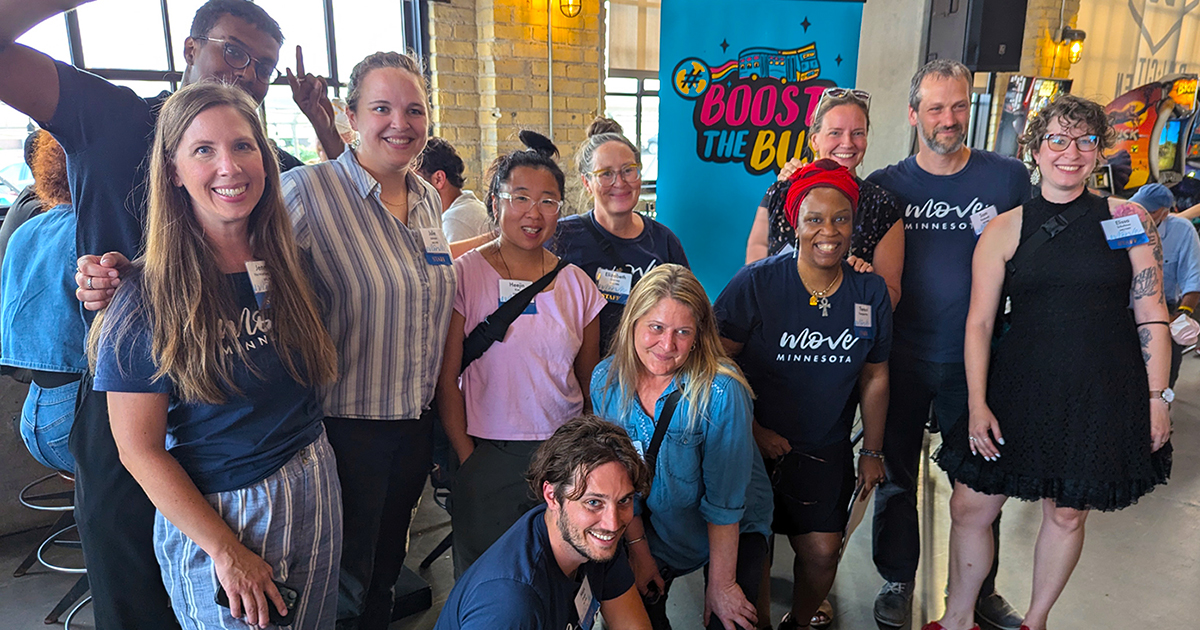 A photo of eleven Move Minnesota staff members gathered at an event.
