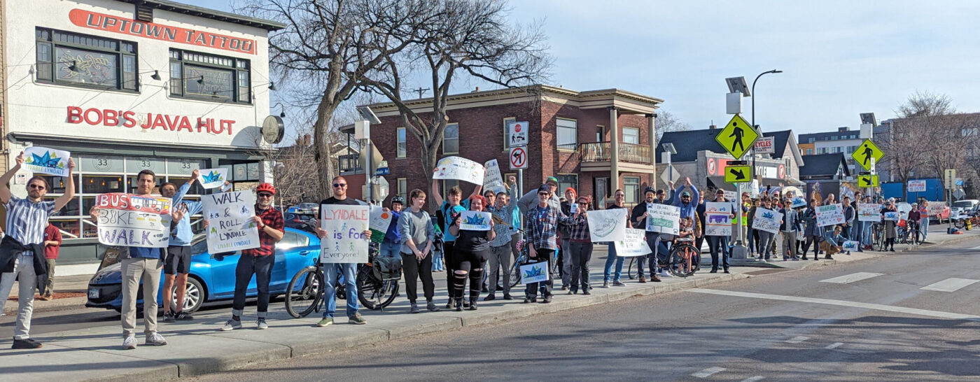 Dozens of advocates in the median on Lyndale at a campaign rally
