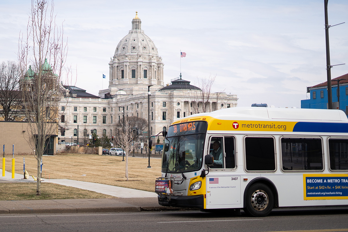A Metro Transit bus outside the Minnesota State Capitol building in Saint Paul.